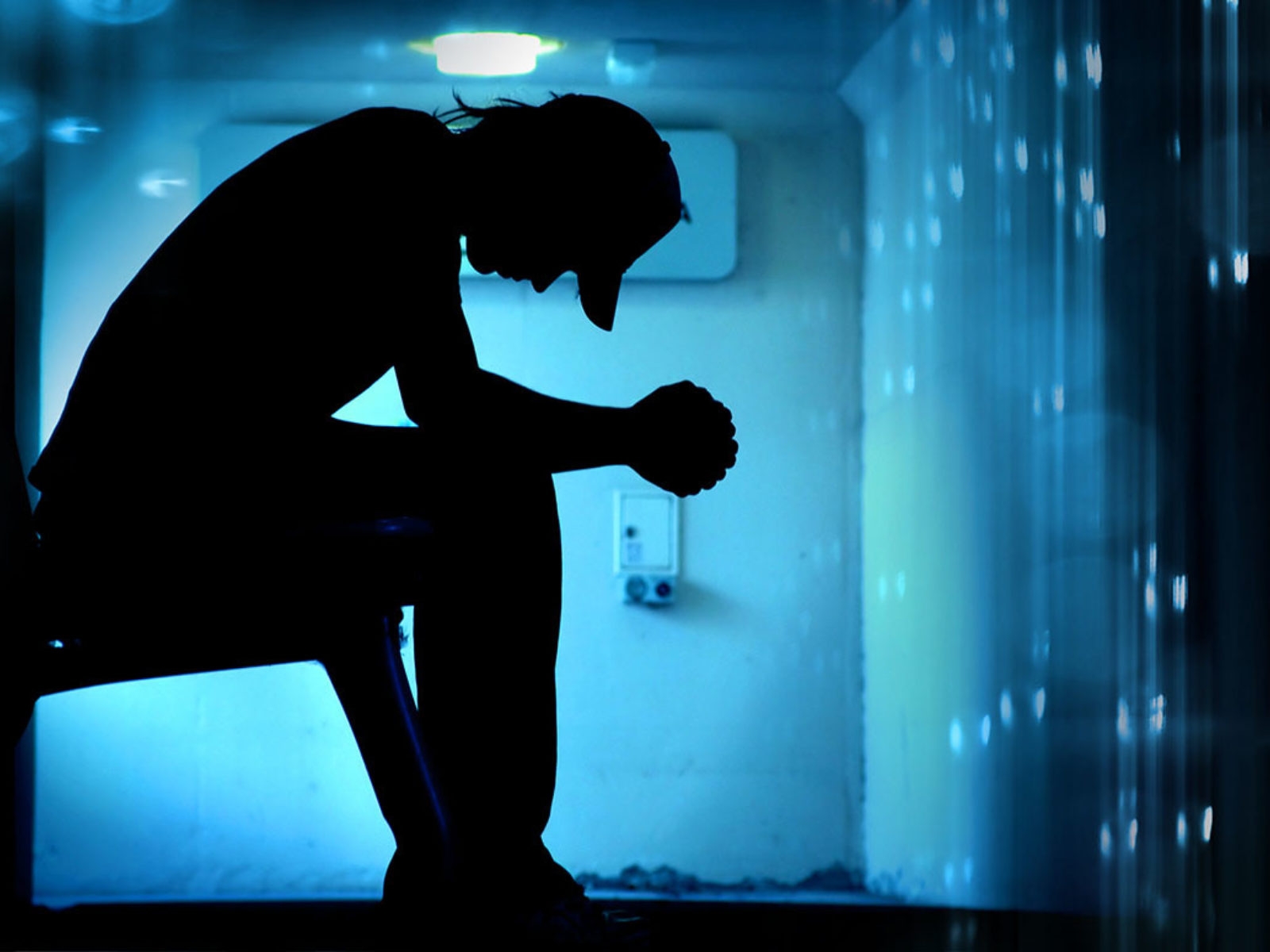 Illustration of silhouetted person against data background
