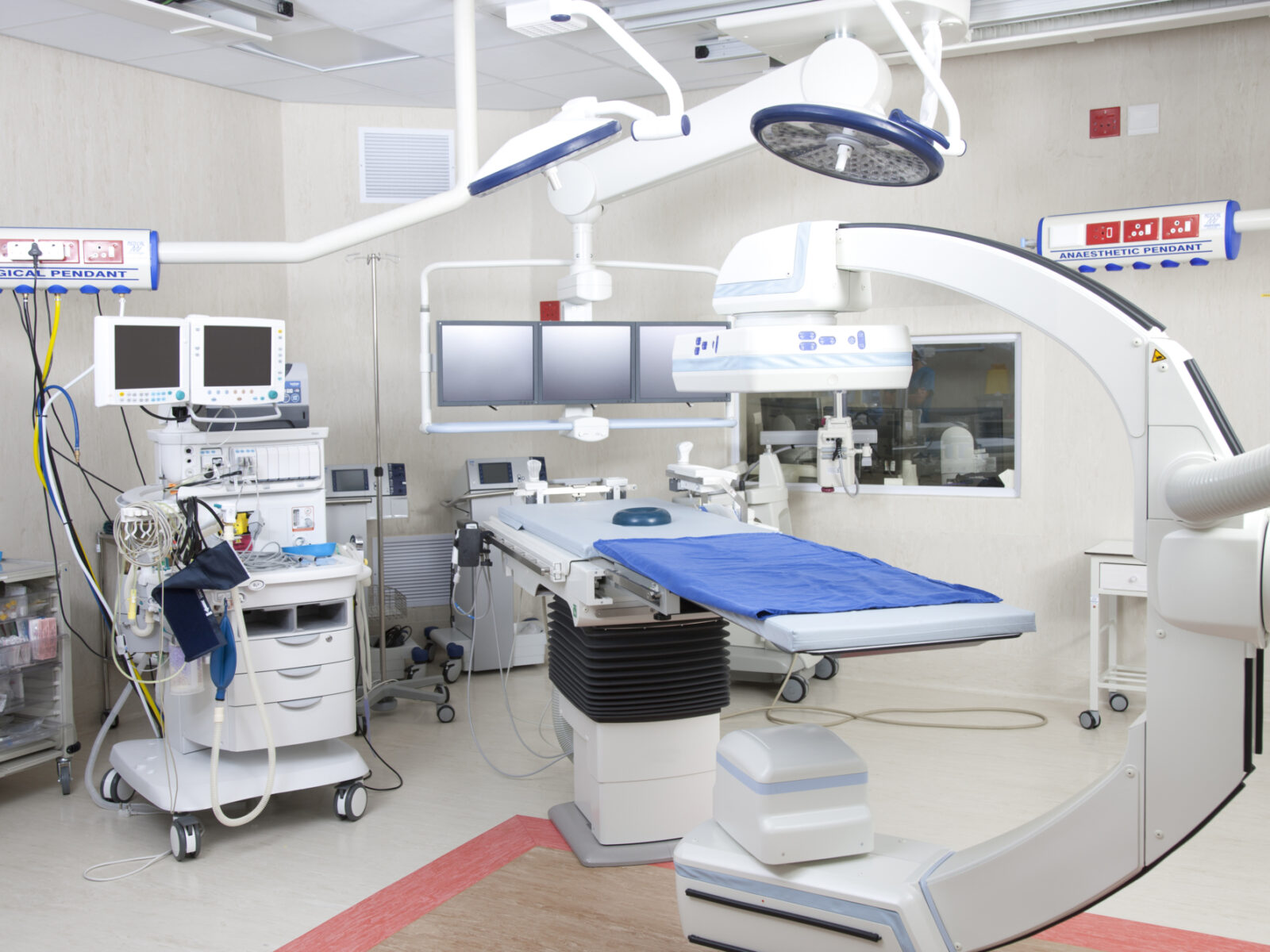 Hospital room with robotic operating machine.