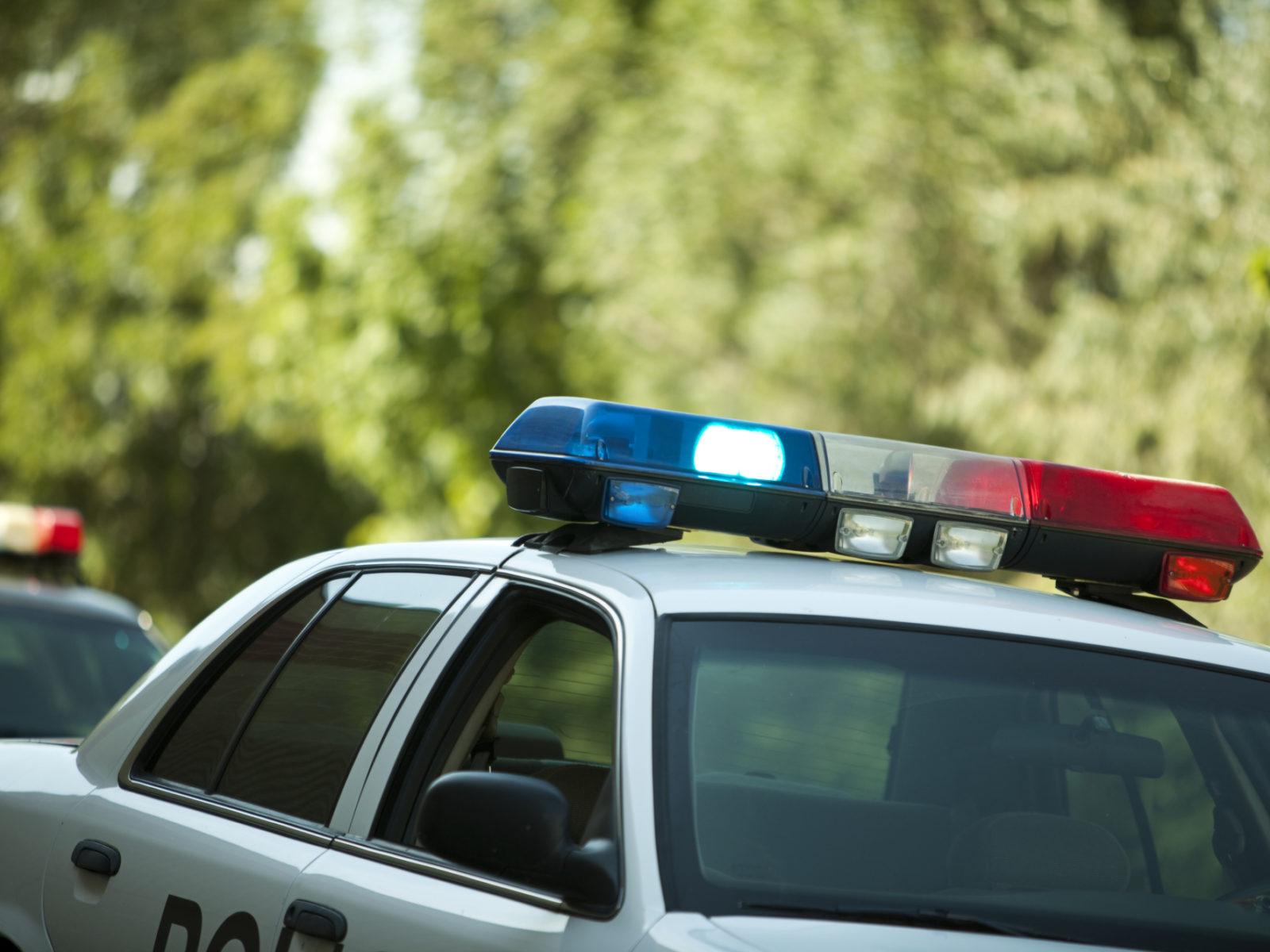 Police vehicle with lights on.