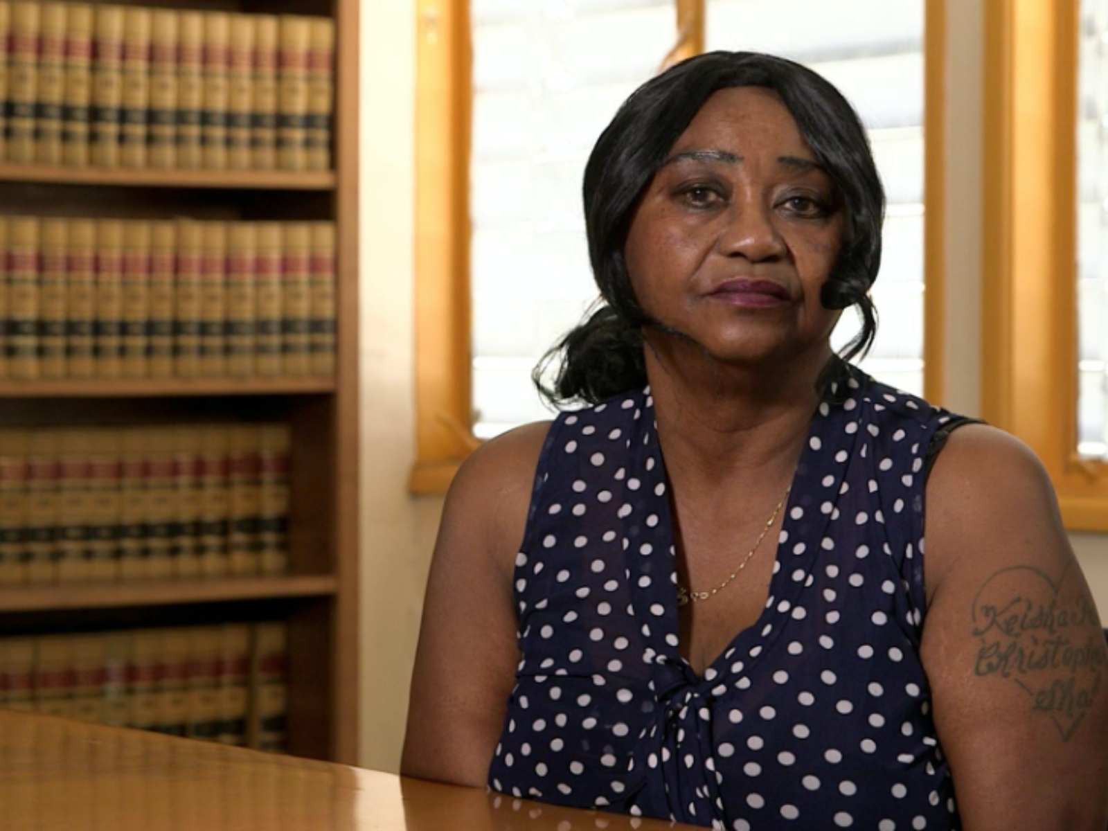 Marie Johnson-Lattier sitting at a table.